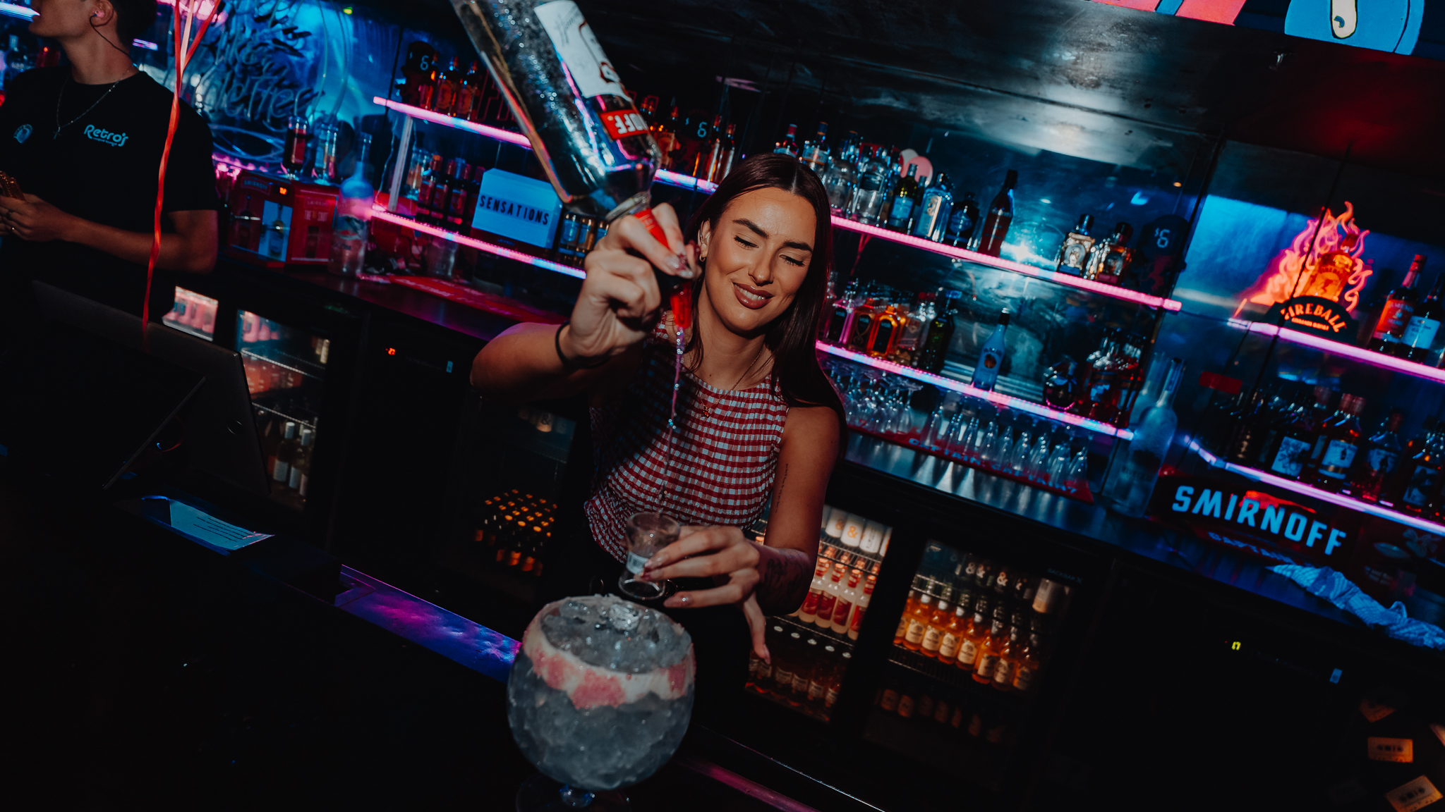Bartender making cocktails at Retros cocktail lounge, Gold Coast