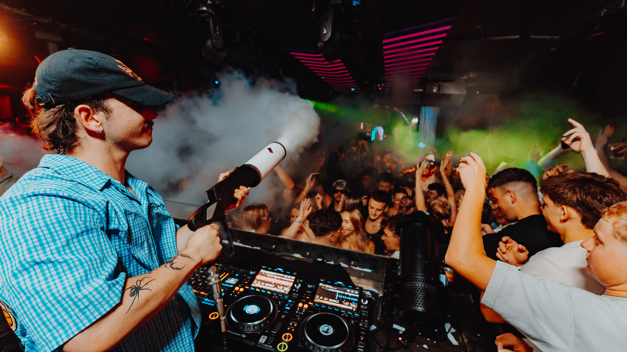 DJ at nightclub decks, Gold Coast