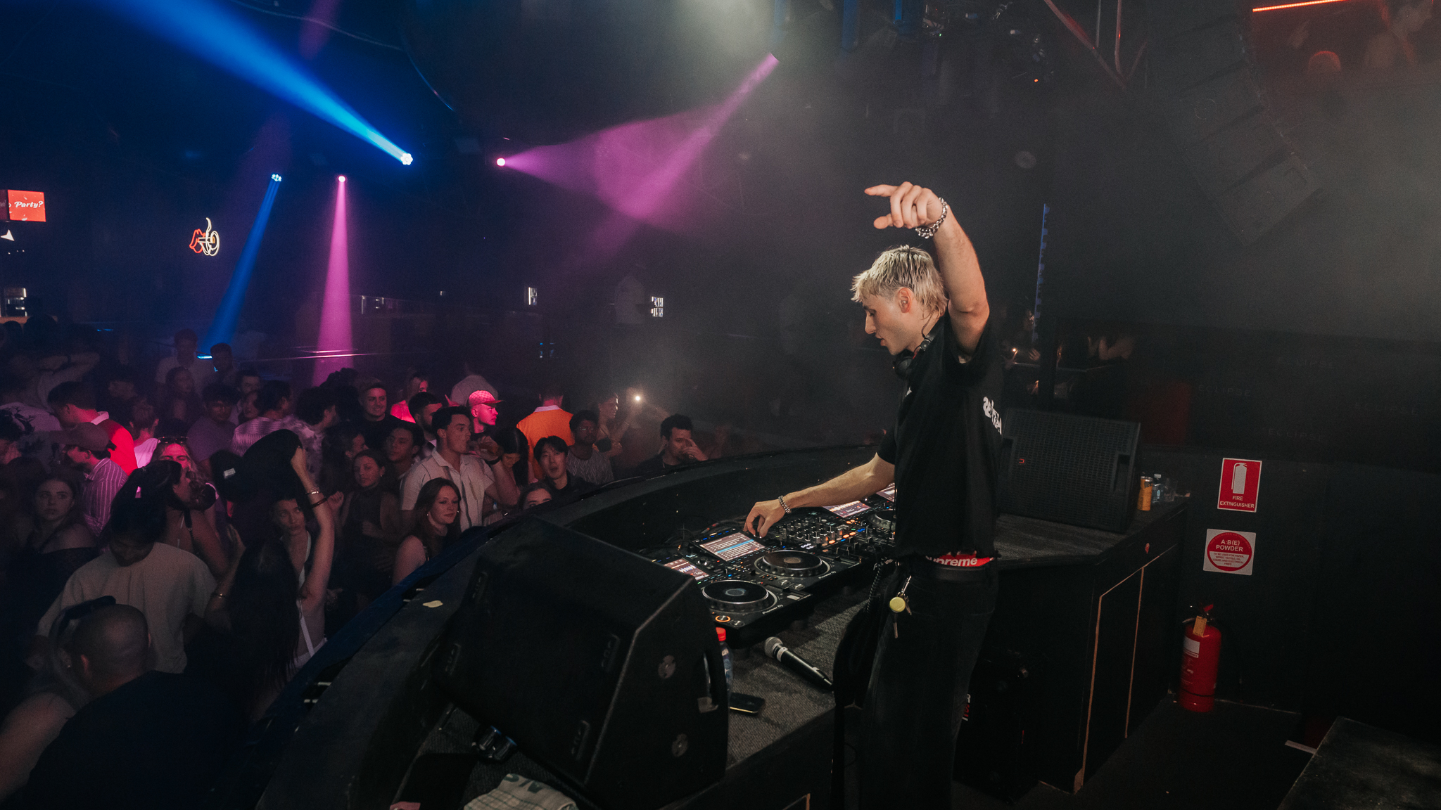 DJ at nightclub decks, Gold Coast venue