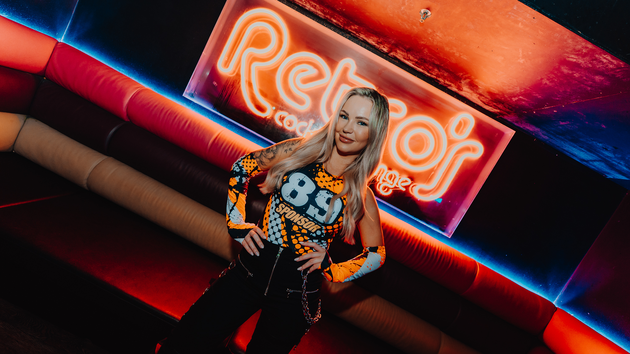 DJ press kit photo at Retros neon sign, Gold Coast