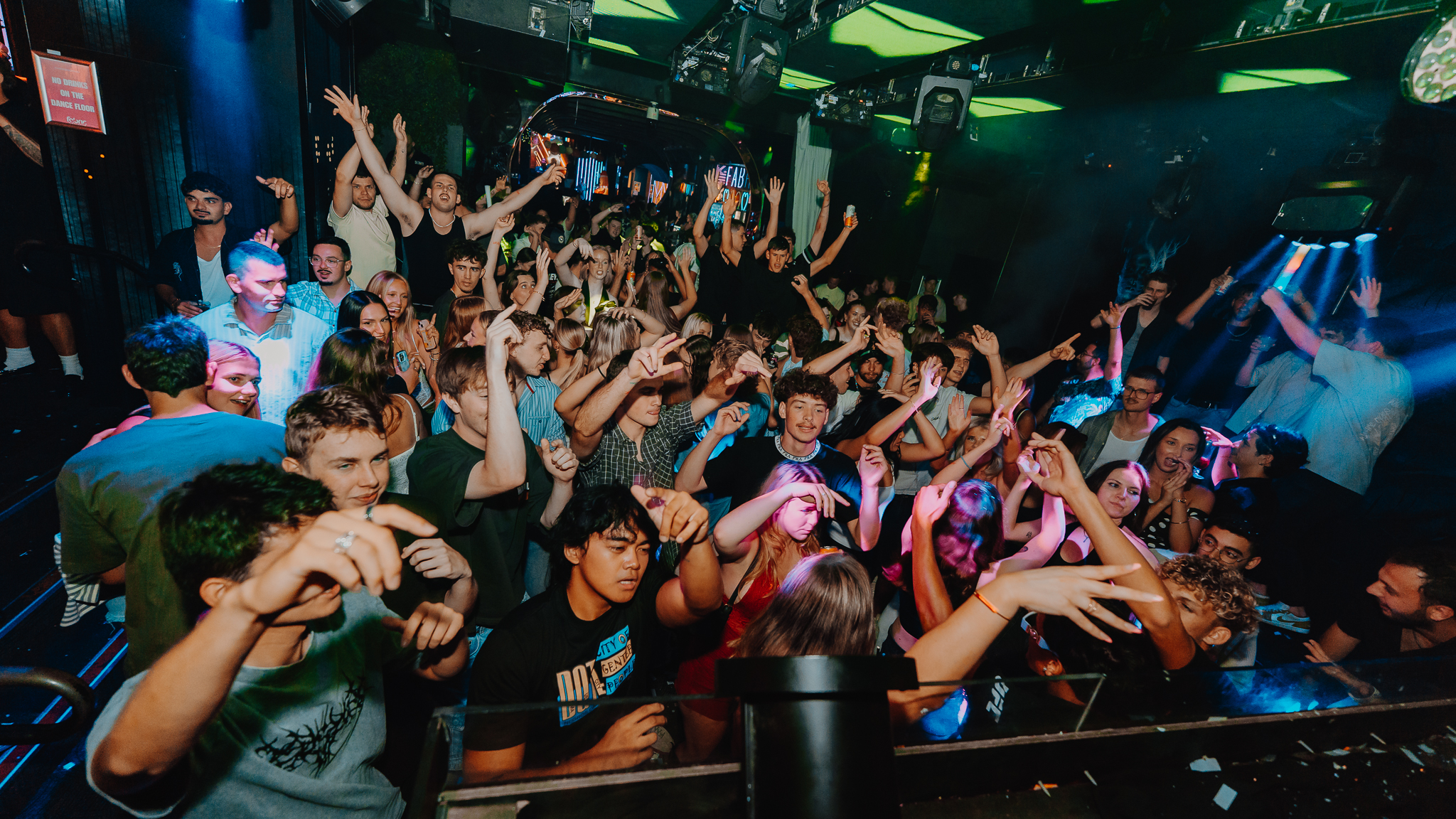 Large crowd hands raised at Gold Coast venue