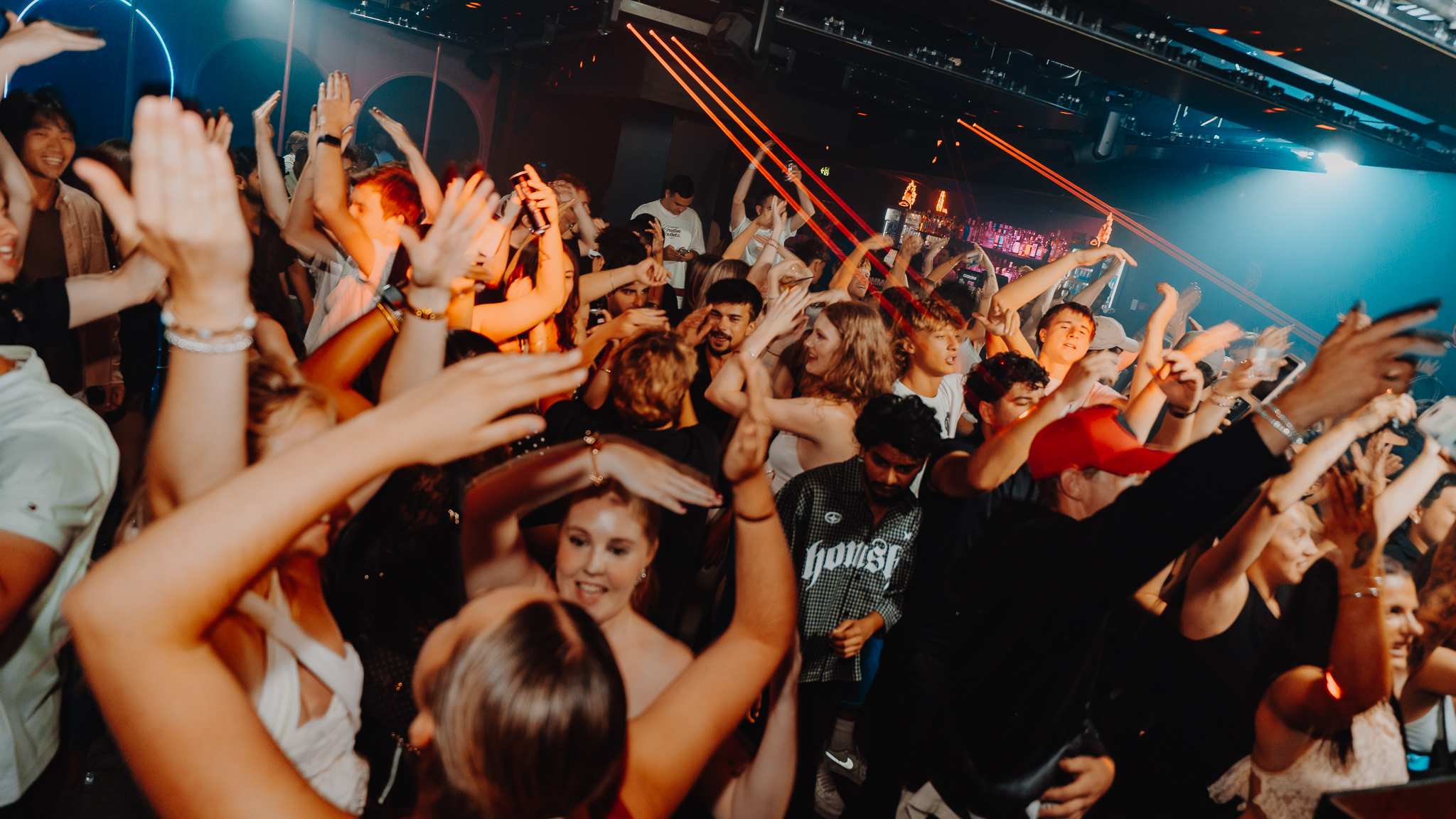 Crowd with raised hands and laser lights, Gold Coast