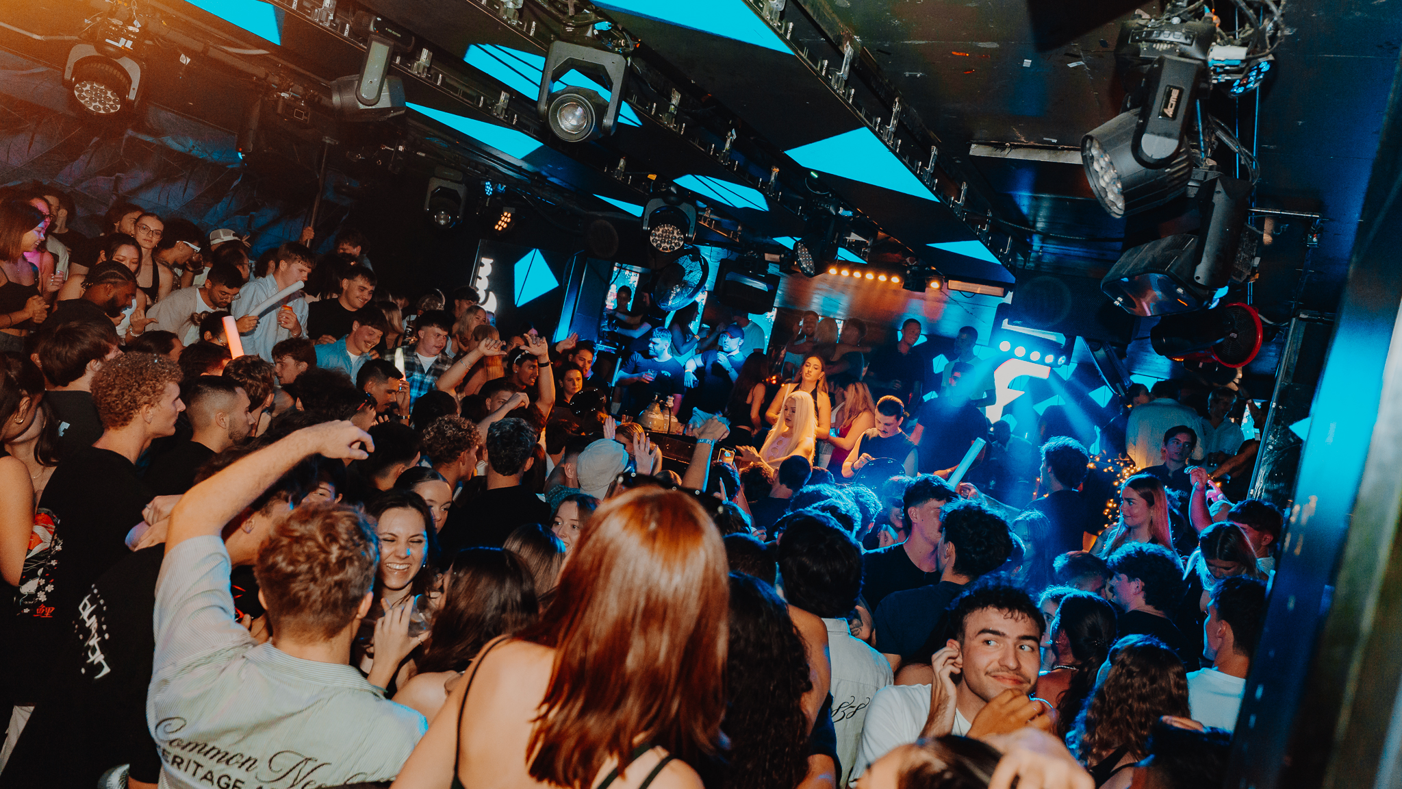 Wide crowd shot with stage performer, Gold Coast venue